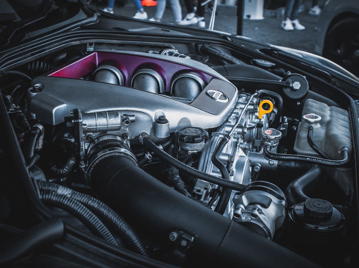 Clean car engine bay showing the engine and components under the hood