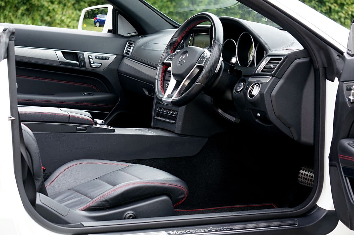 Clean modern car interior showing dashboard, steering wheel, and centre console