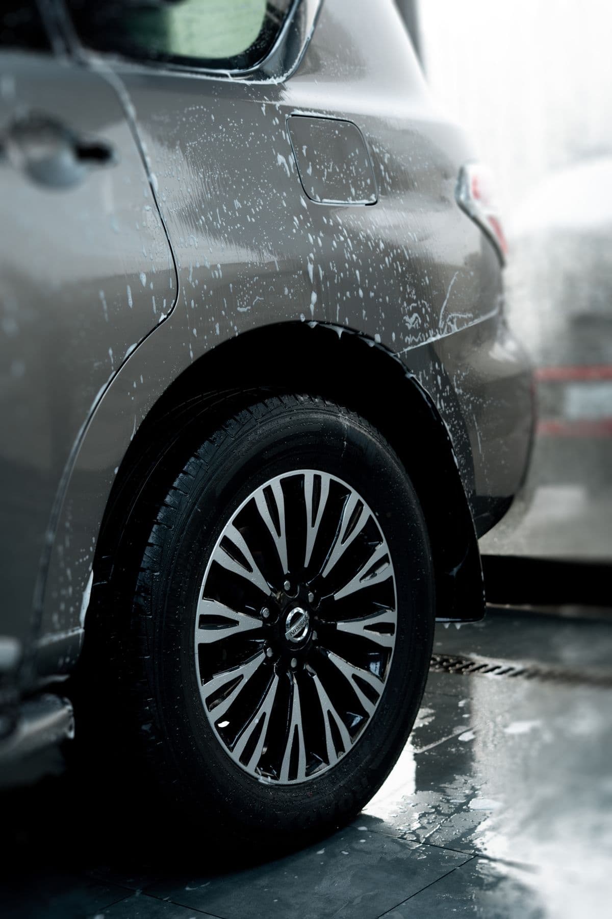 Close-up of a clean car wheel and rim during washing